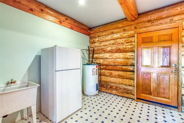 a bathroom with a refrigerator and a stove