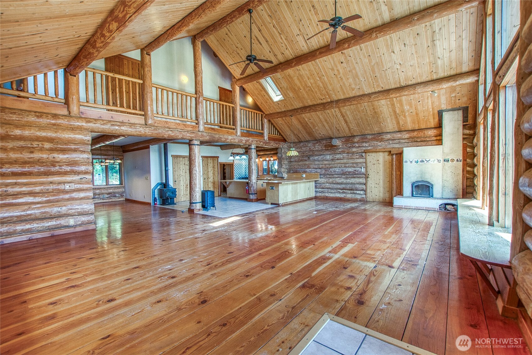 245 Roehl's Hill Road Orcas Island, WA 98279 - Photo 24 of 40 a view of a patio with dining table and chairs with wooden floor