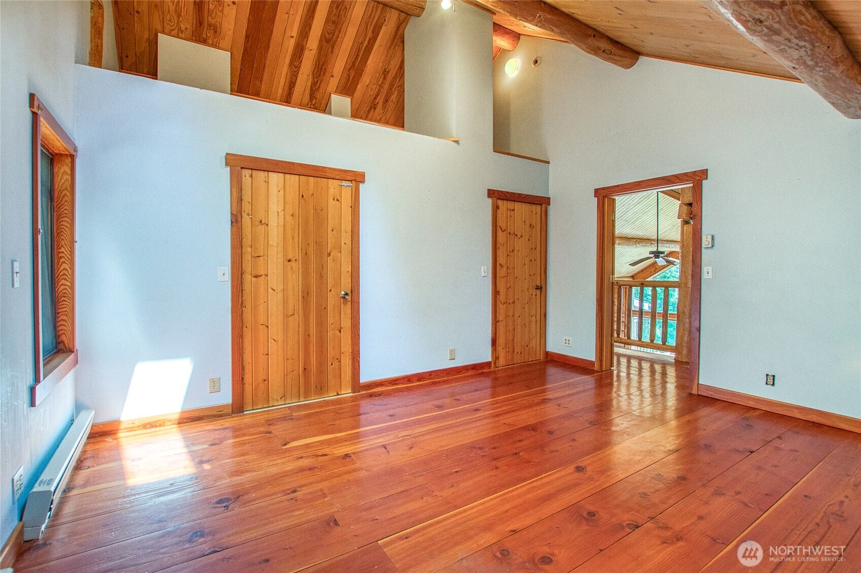 245 Roehl's Hill Road Orcas Island, WA 98279 - Photo 31 of 40 a view of an empty room with wooden floor and a window