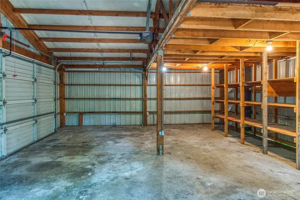 a view of an empty room with empty shelves