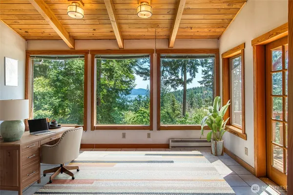a living room filled with furniture and a window