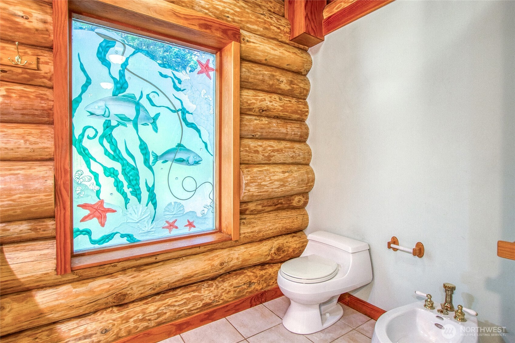 245 Roehl's Hill Road Orcas Island, WA 98279 - Photo 8 of 40 a bathroom with a toilet and a shower curtain