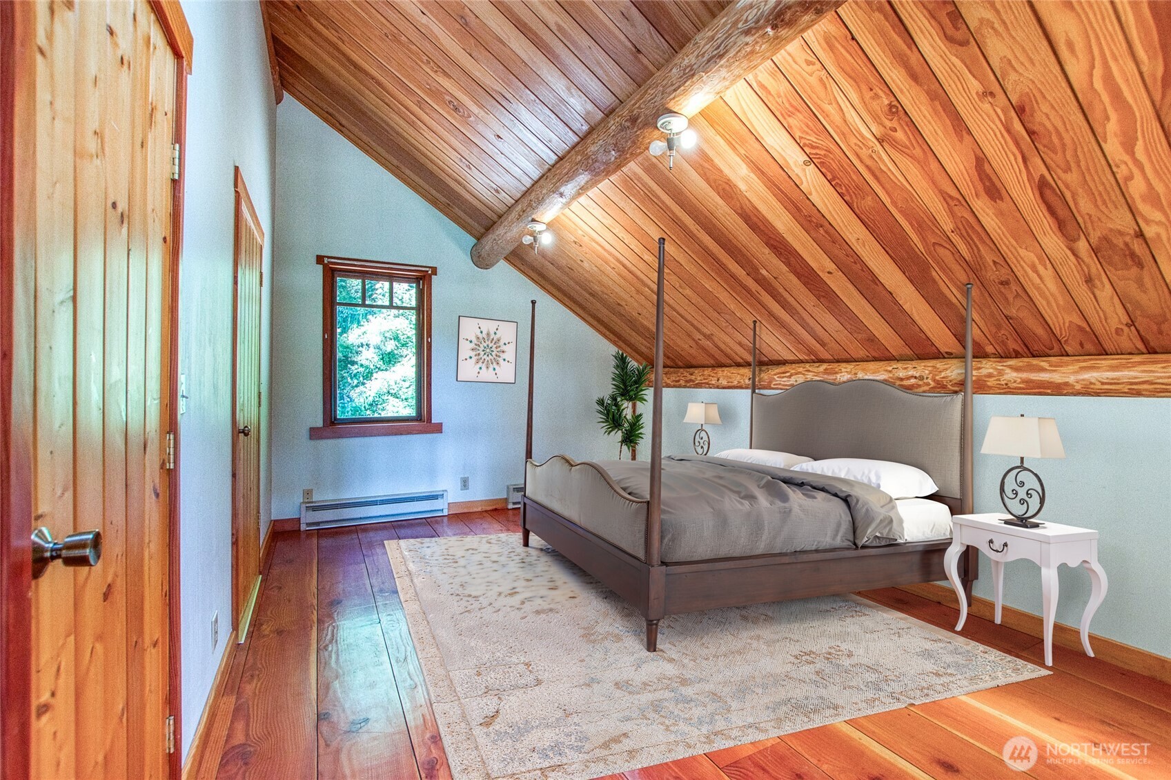 245 Roehl's Hill Road Orcas Island, WA 98279 - Photo 9 of 40 a bedroom with a bed and a table