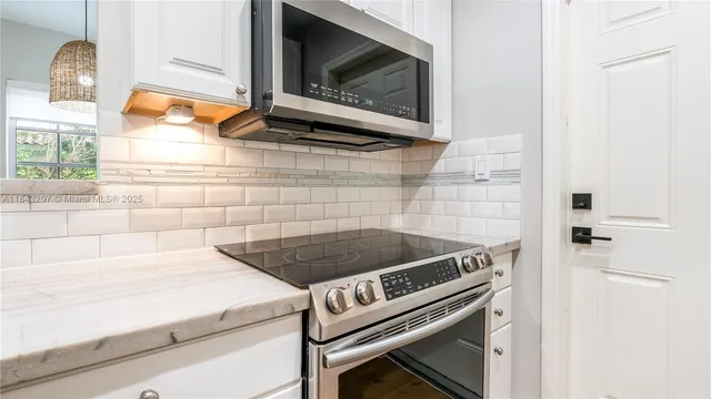 a close view of a stove a microwave and stove