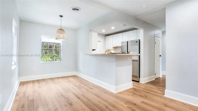 a view of kitchen and wooden floor