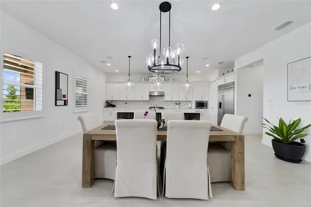 a kitchen with kitchen island granite countertop a sink counter top space and stainless steel appliances