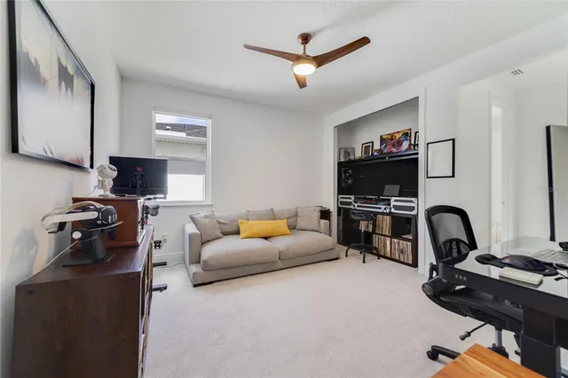 a spacious bedroom with a bed furniture and a window