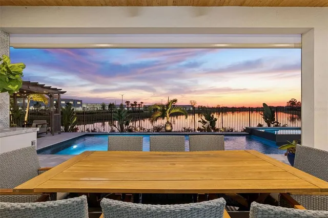 a living room with furniture and a floor to ceiling window