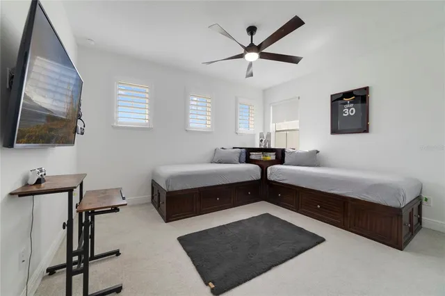 a bathroom with a toilet sink vanity and mirror