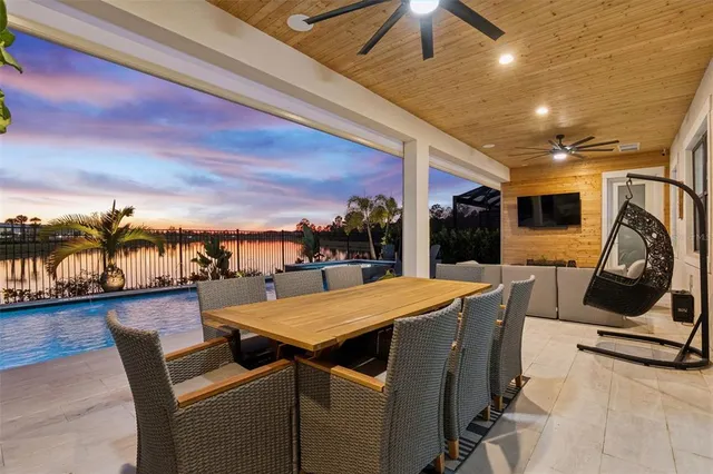 a view of a house with pool porch and furniture