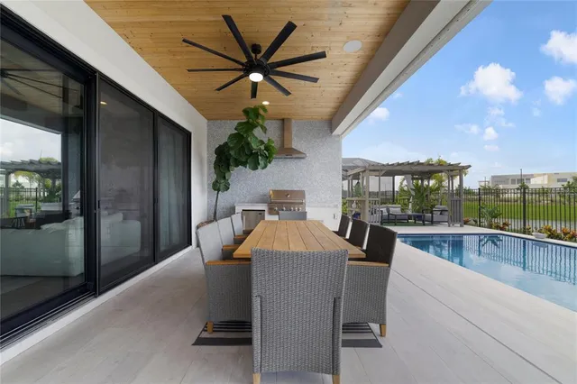 aerial view of a house with a backyard and a chair