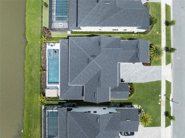 a front view of a house with a garden and plants