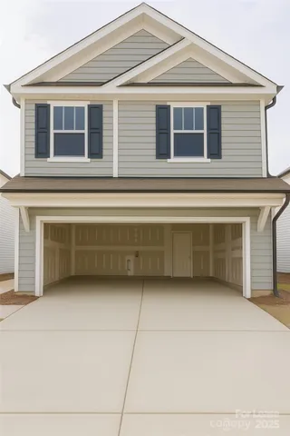 a front view of a house with a garage