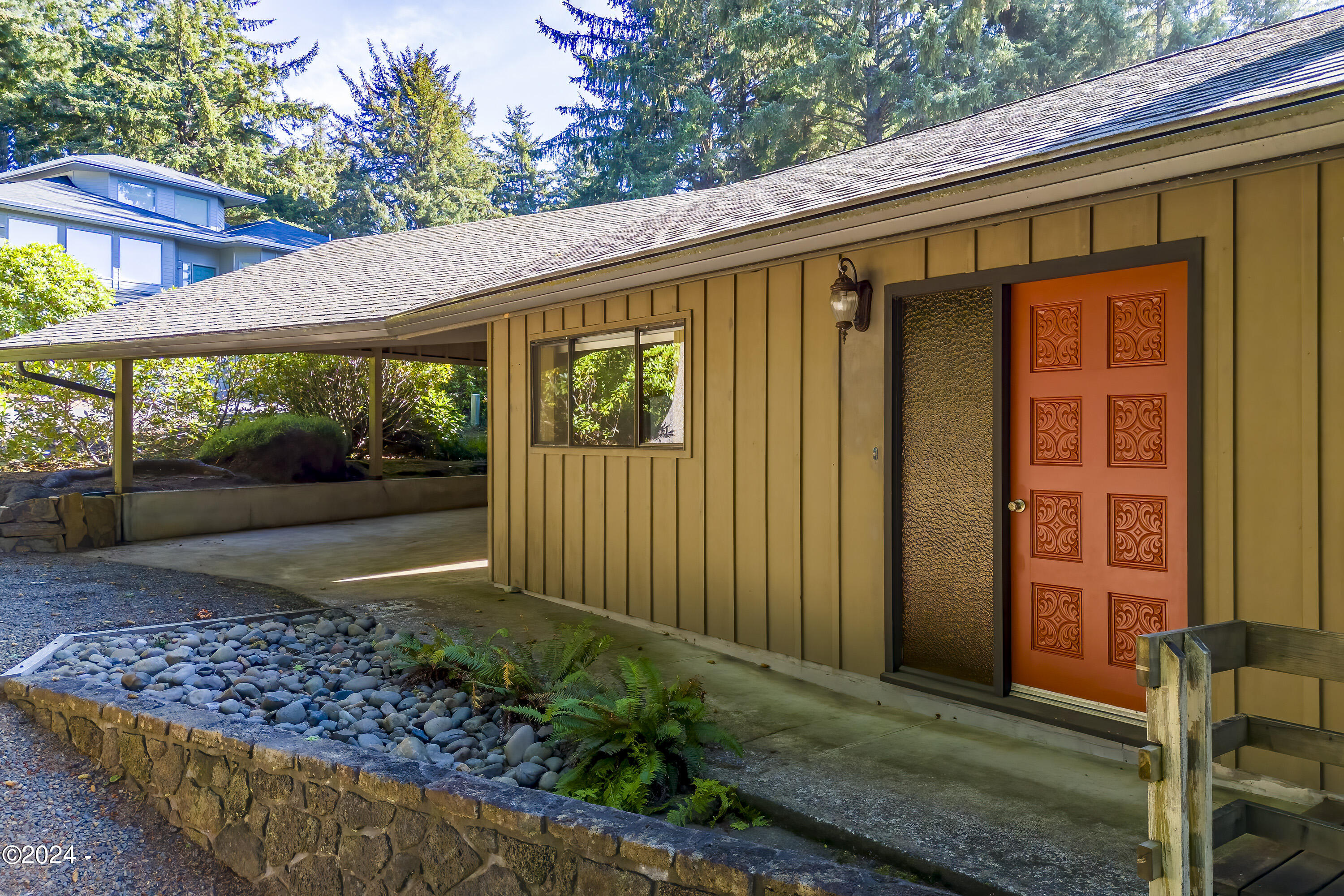 114 Ridge Crest Road Gleneden Beach, OR 97388 - Photo 4 of 40 a view of a house with a porch
