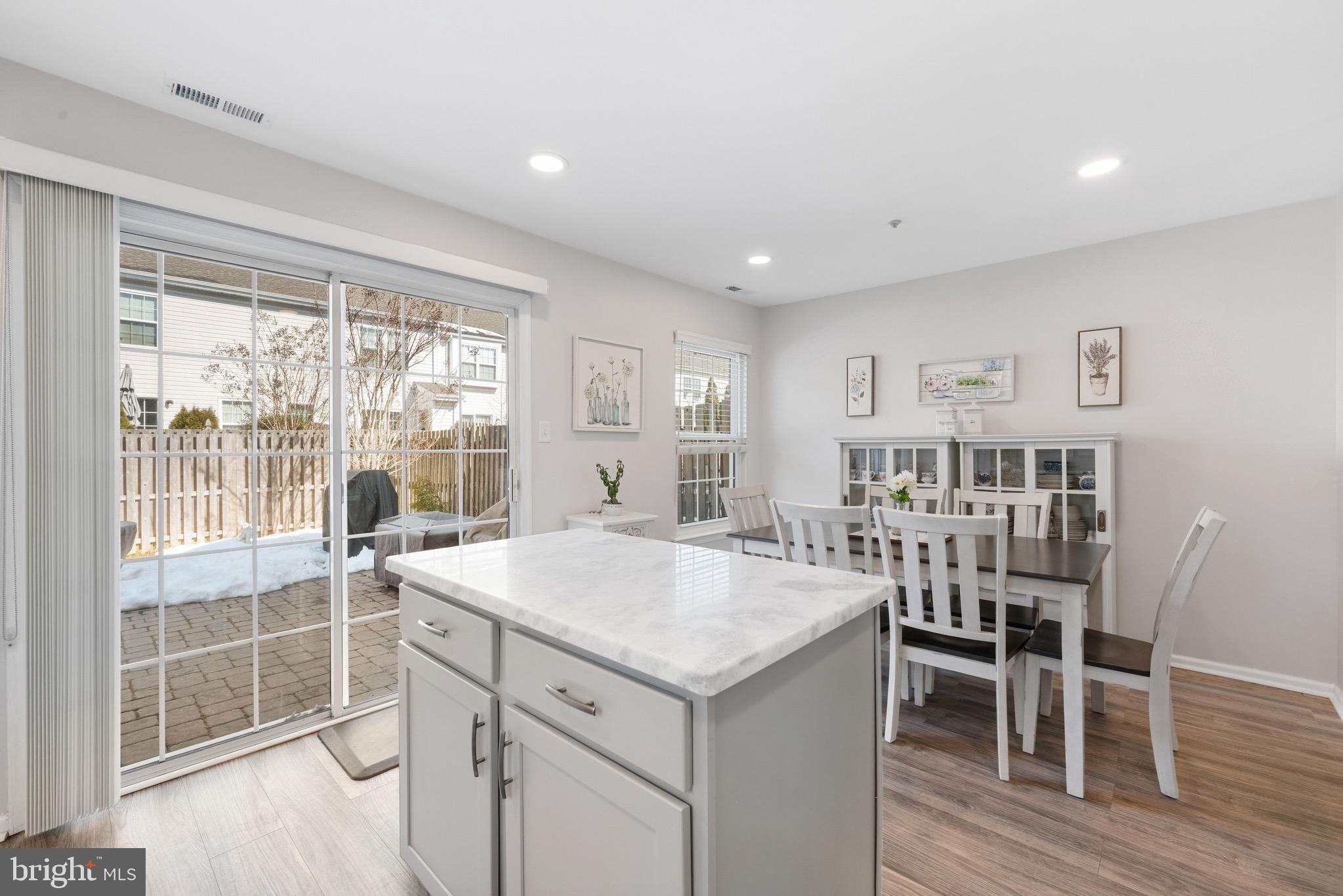 135 Buckingham Way Mount Laurel, NJ 08054 - Photo 17 of 30 a open kitchen with dining table and chairs