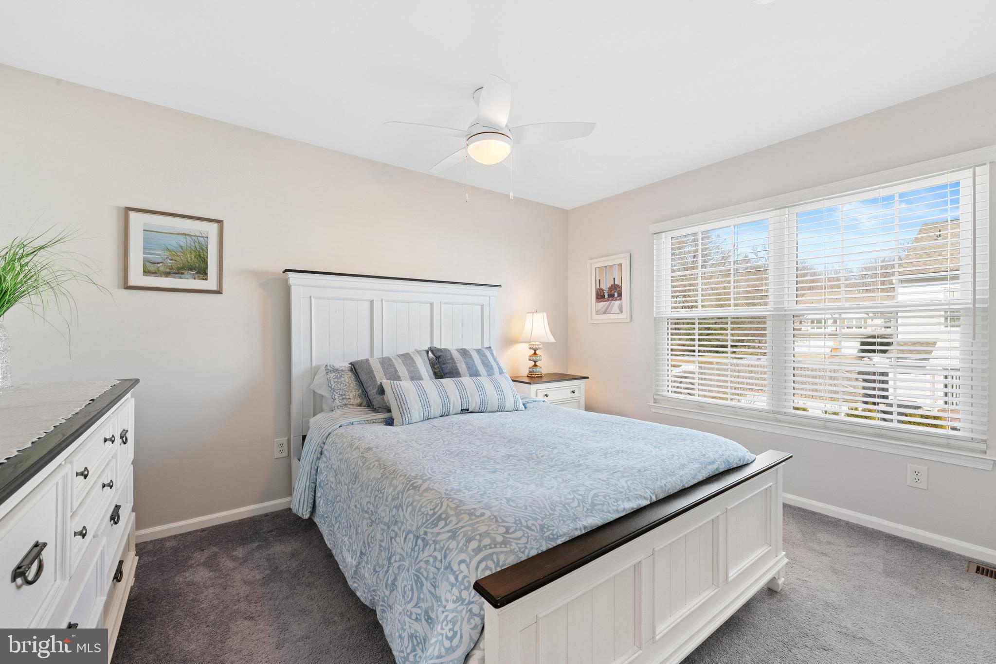 135 Buckingham Way Mount Laurel, NJ 08054 - Photo 19 of 30 a bedroom with a large bed and a window