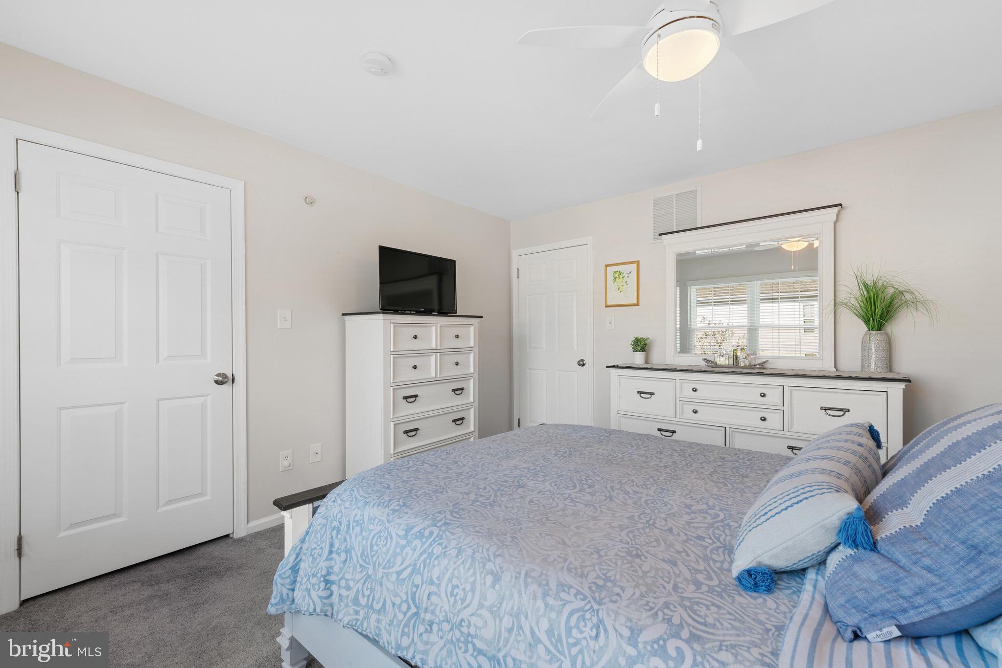 135 Buckingham Way Mount Laurel, NJ 08054 - Photo 20 of 30 a bedroom with a bed and a flat screen tv