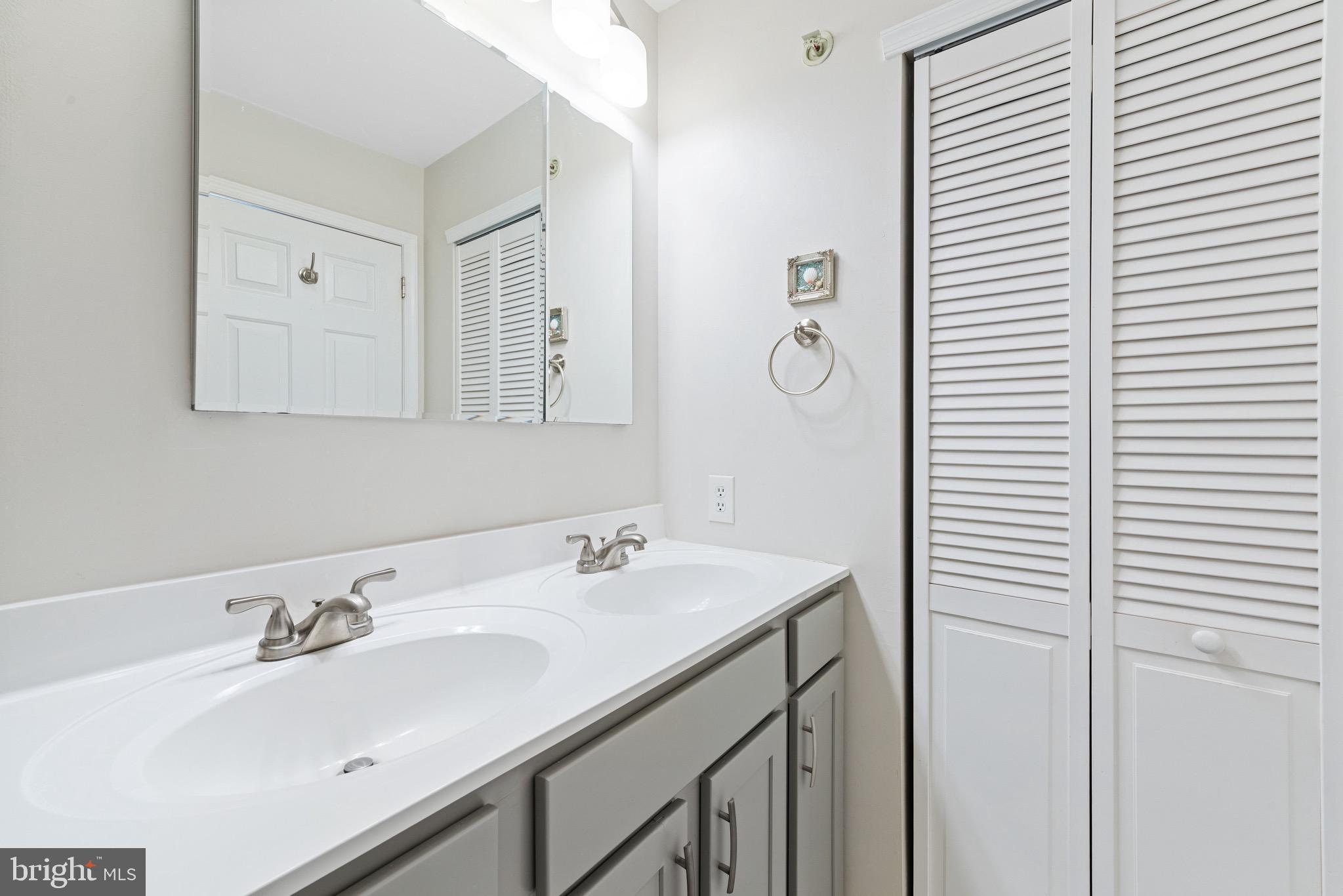 135 Buckingham Way Mount Laurel, NJ 08054 - Photo 22 of 30 a bathroom with a sink and a mirror