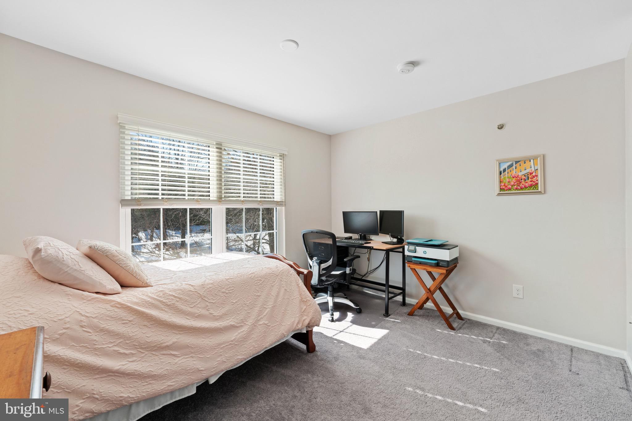 135 Buckingham Way Mount Laurel, NJ 08054 - Photo 25 of 30 a bedroom with a bed and a desk