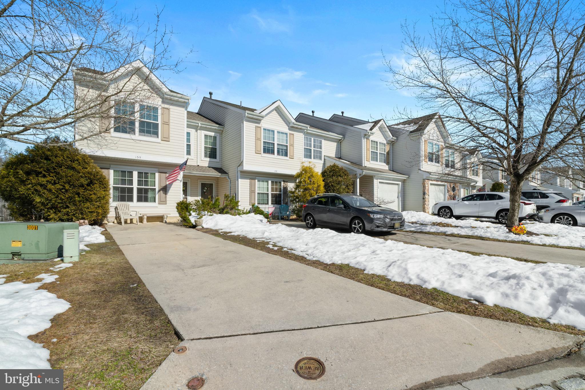135 Buckingham Way Mount Laurel, NJ 08054 - Photo 3 of 30 a front view of a building with a bench