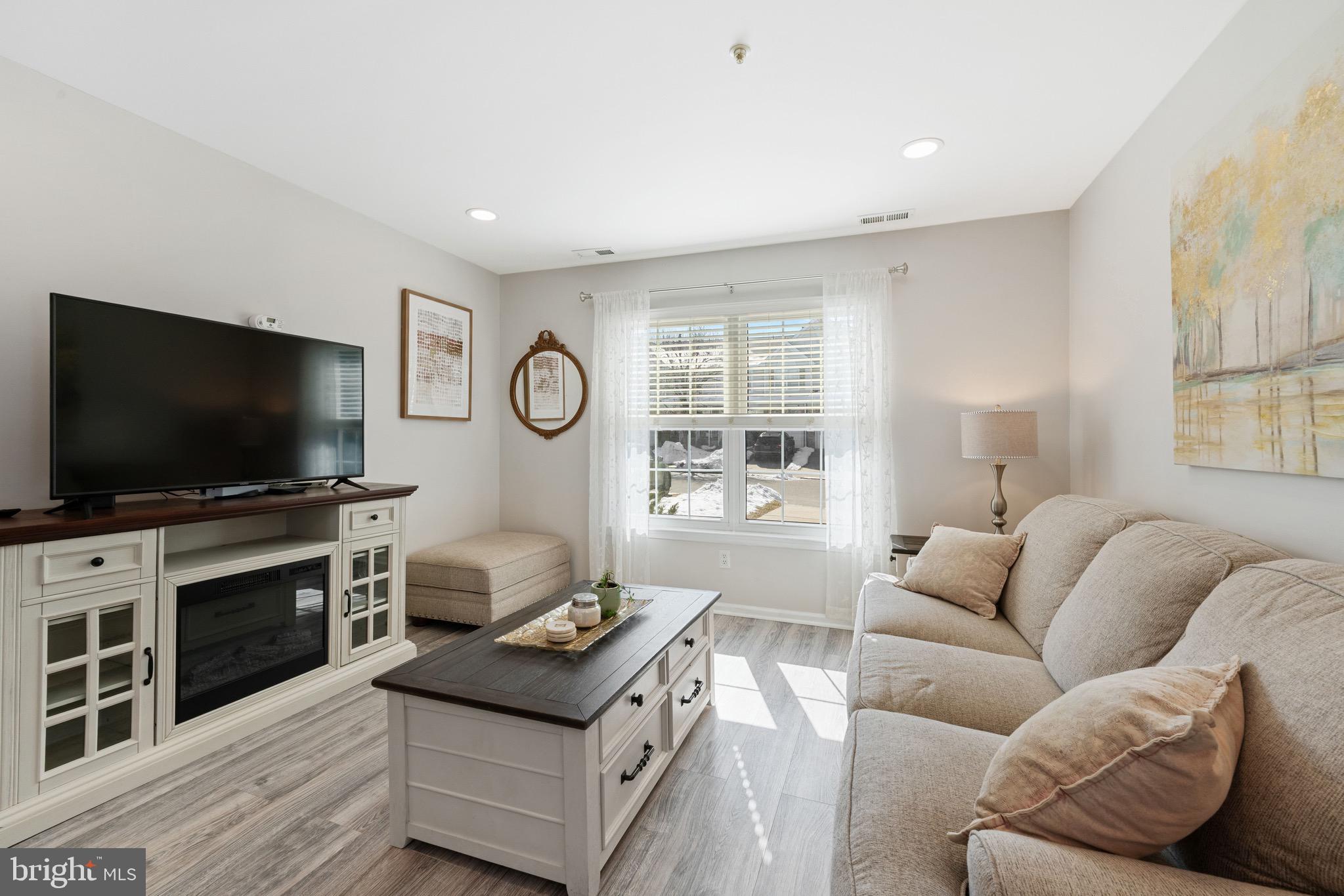 135 Buckingham Way Mount Laurel, NJ 08054 - Photo 7 of 30 a living room with furniture and a flat screen tv