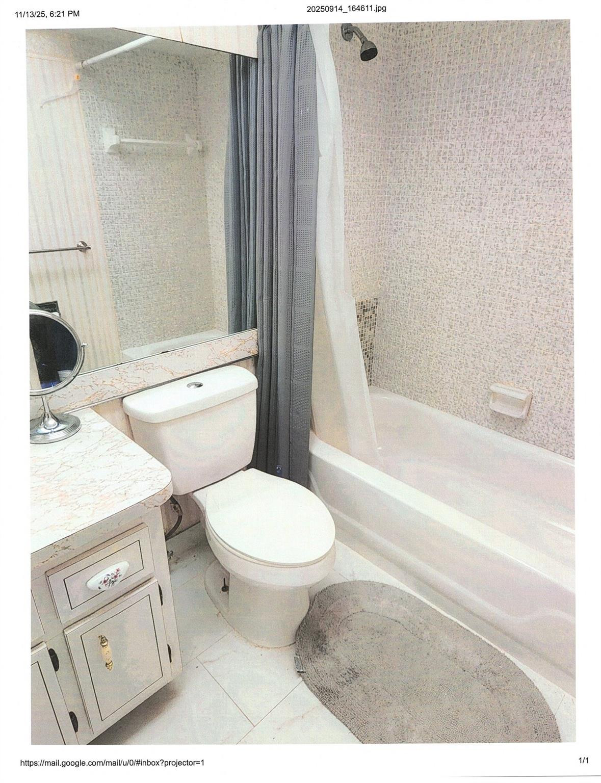 4411 Northwest 16th Street Lauderhill, FL 33313 - Photo 10 of 18 a bathroom with a toilet a sink and bathtub