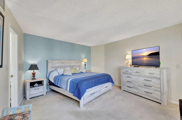 a bedroom with two beds and painted walls