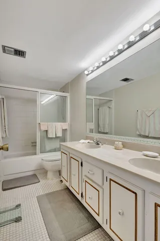 a bathroom with a sink a vanity and a mirror