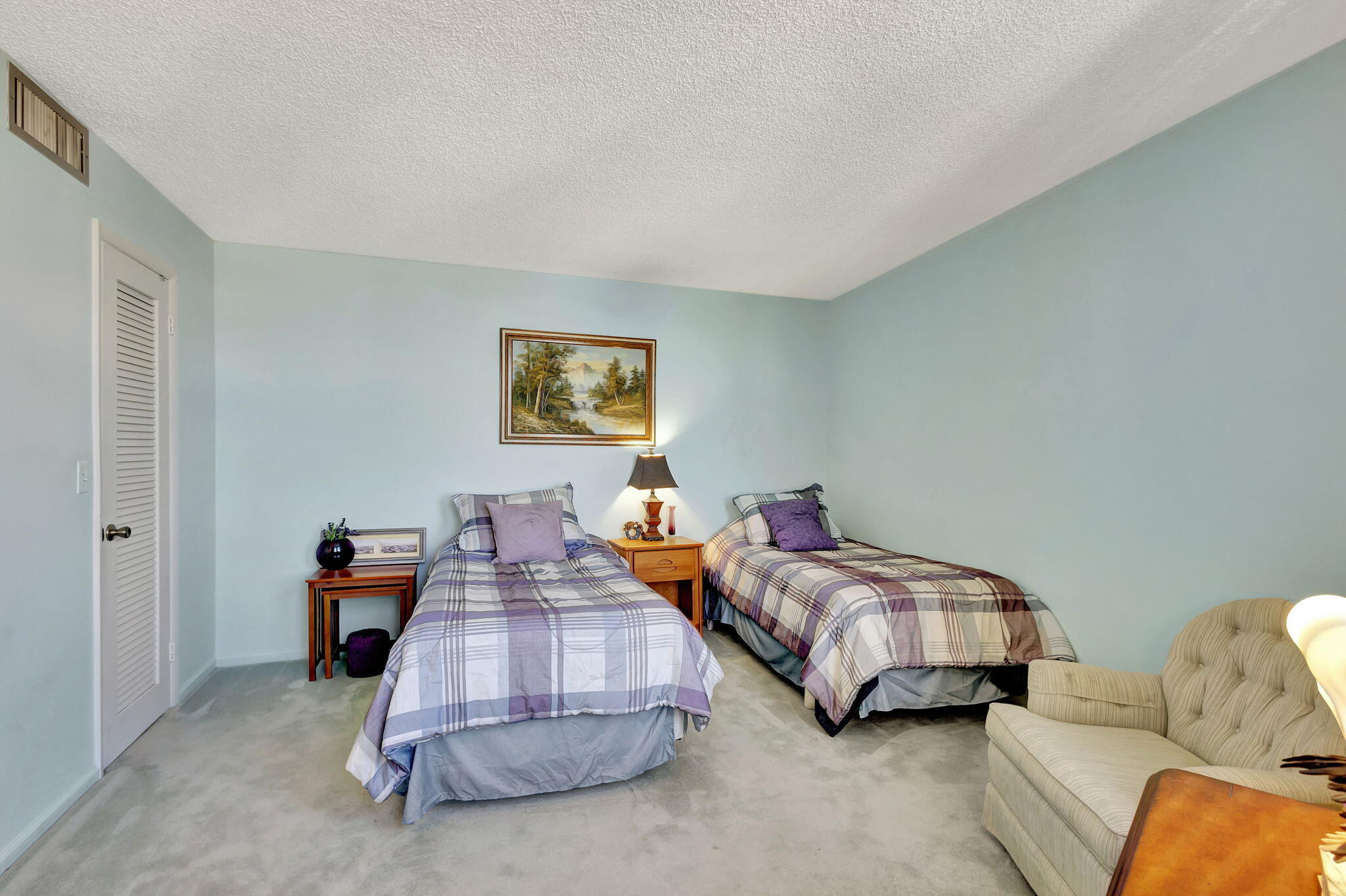 2800 North Ocean Drive, Unit A24B Singer Island, FL 33404 - Photo 23 of 65 a bedroom with two beds and painted walls