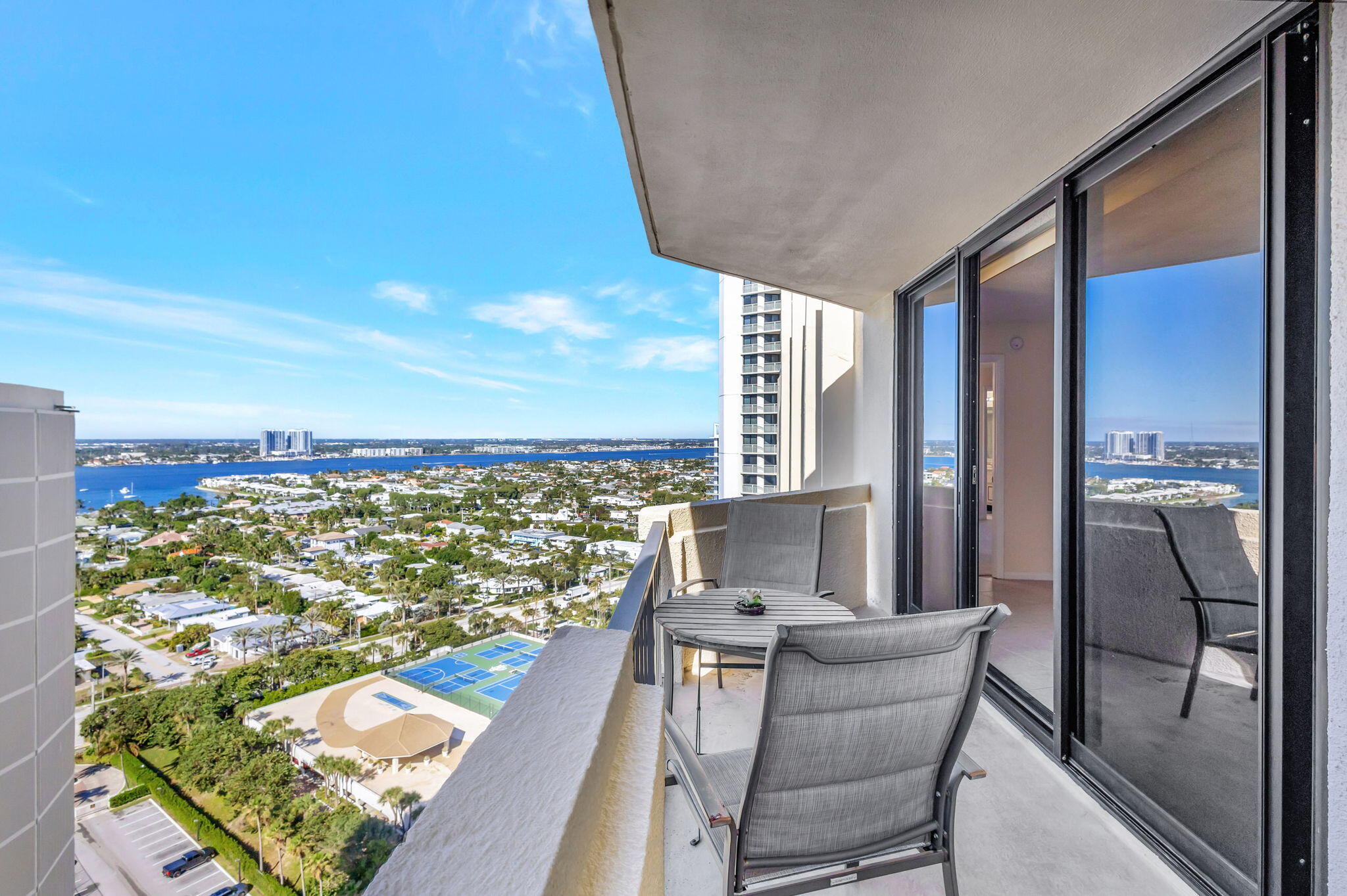 2800 North Ocean Drive, Unit A24B Singer Island, FL 33404 - Photo 31 of 65 a view of a balcony with furniture and a city view