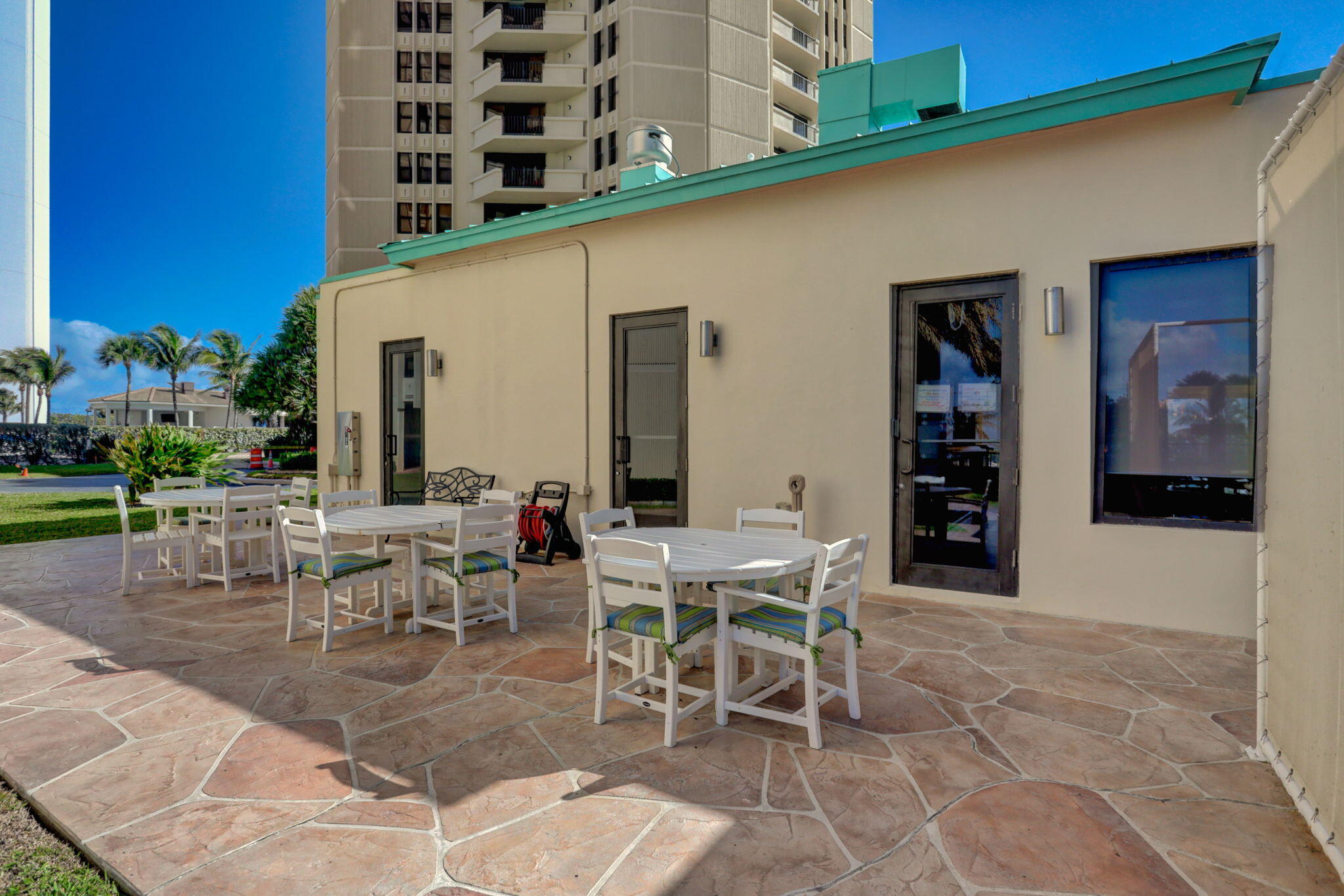 2800 North Ocean Drive, Unit A24B Singer Island, FL 33404 - Photo 45 of 65 a view of a patio with table and chairs