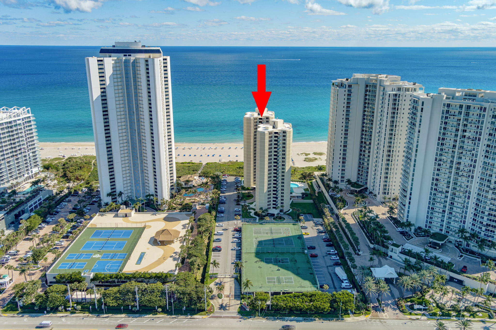 2800 North Ocean Drive, Unit A24B Singer Island, FL 33404 - Photo 54 of 65 a multi story building with glass windows and yard