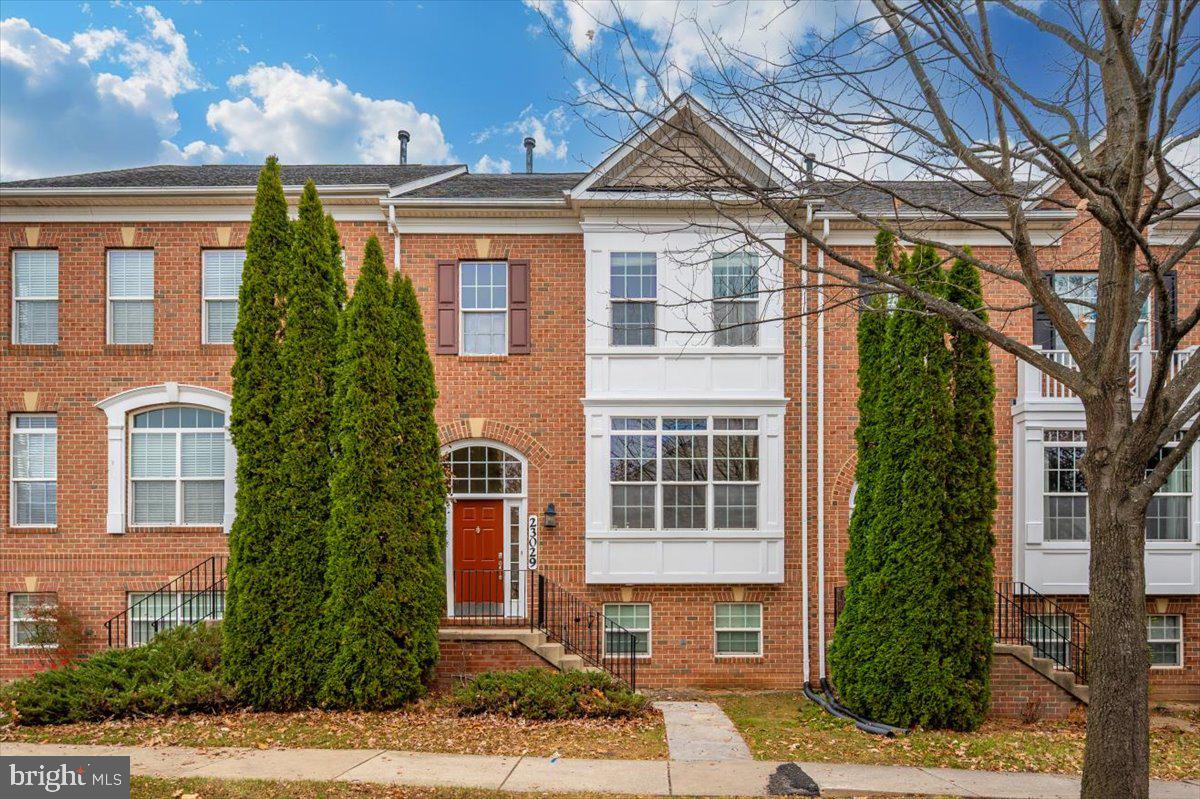 23029 Birch Mead Road Clarksburg, MD 20871 - Photo 1 of 30 a front view of a residential apartment building with a yard