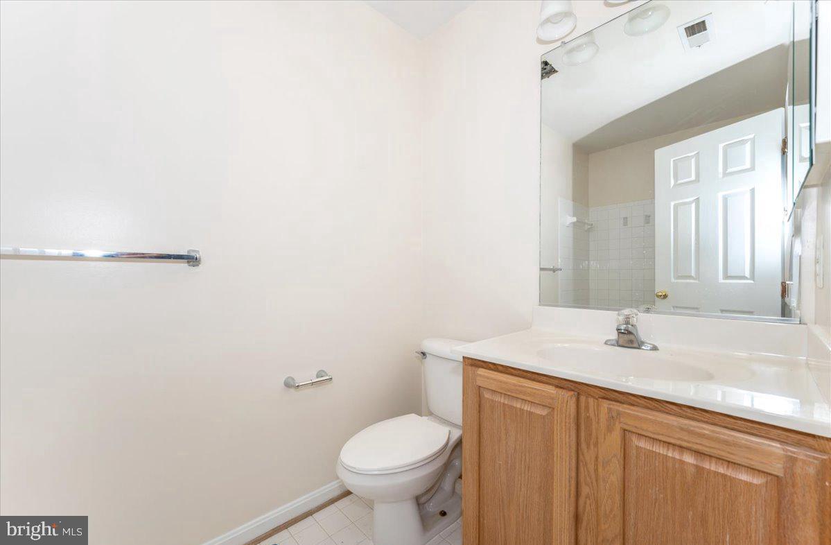 23029 Birch Mead Road Clarksburg, MD 20871 - Photo 20 of 30 a bathroom with a sink toilet and vanity