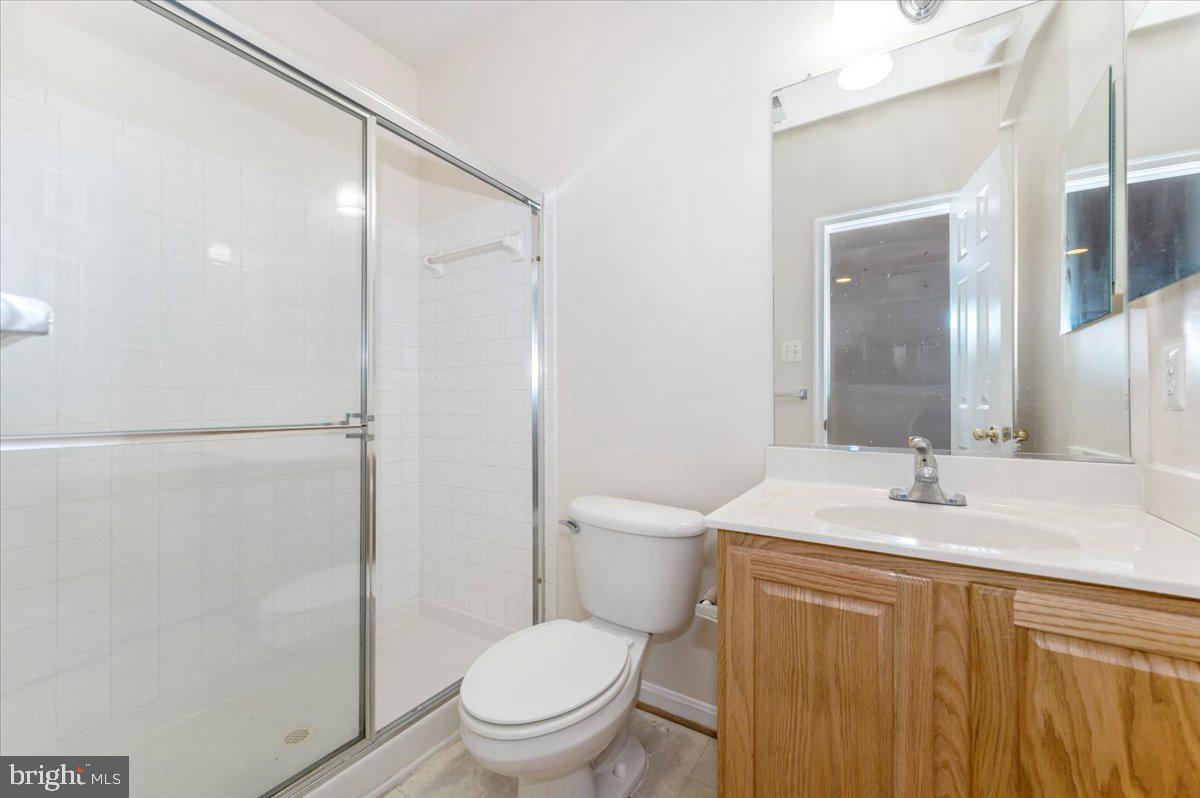 23029 Birch Mead Road Clarksburg, MD 20871 - Photo 26 of 30 a bathroom with a sink toilet and shower