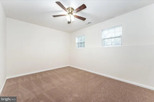 a backyard of a house with yard and outdoor seating