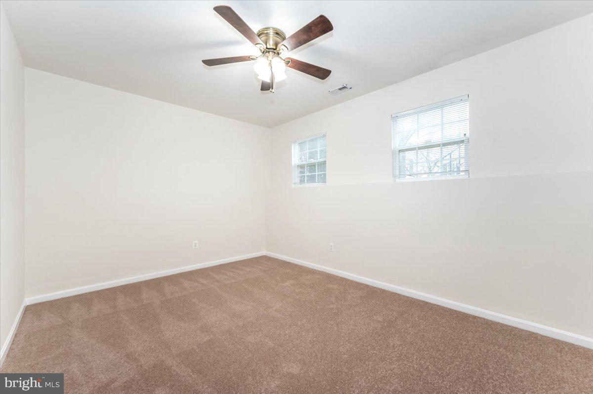 23029 Birch Mead Road Clarksburg, MD 20871 - Photo 27 of 30 an empty room with a window and a fan