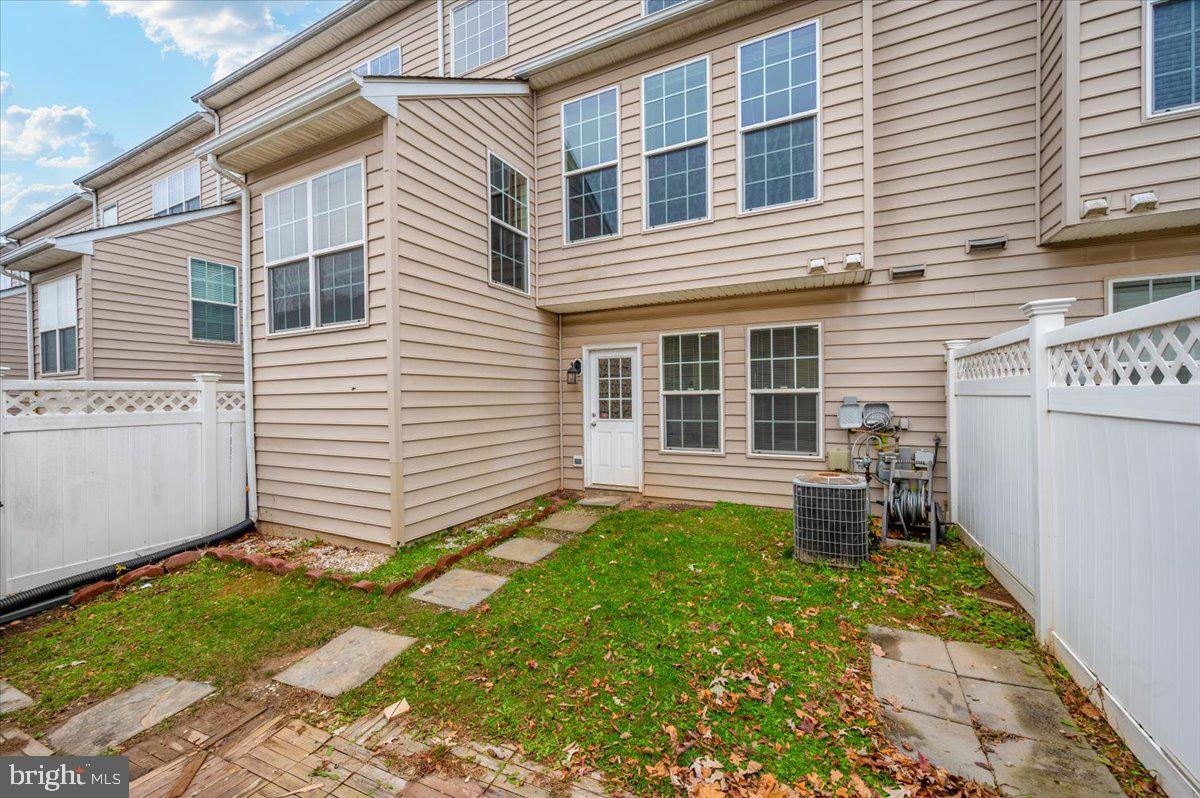 23029 Birch Mead Road Clarksburg, MD 20871 - Photo 28 of 30 a backyard of a house with yard and outdoor seating