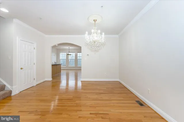 a view of a kitchen with granite countertop cabinets and wooden floor