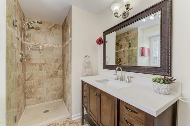 a bathroom with a double vanity sink and a mirror