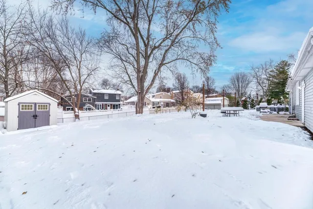 a view of city street with a snow on the road