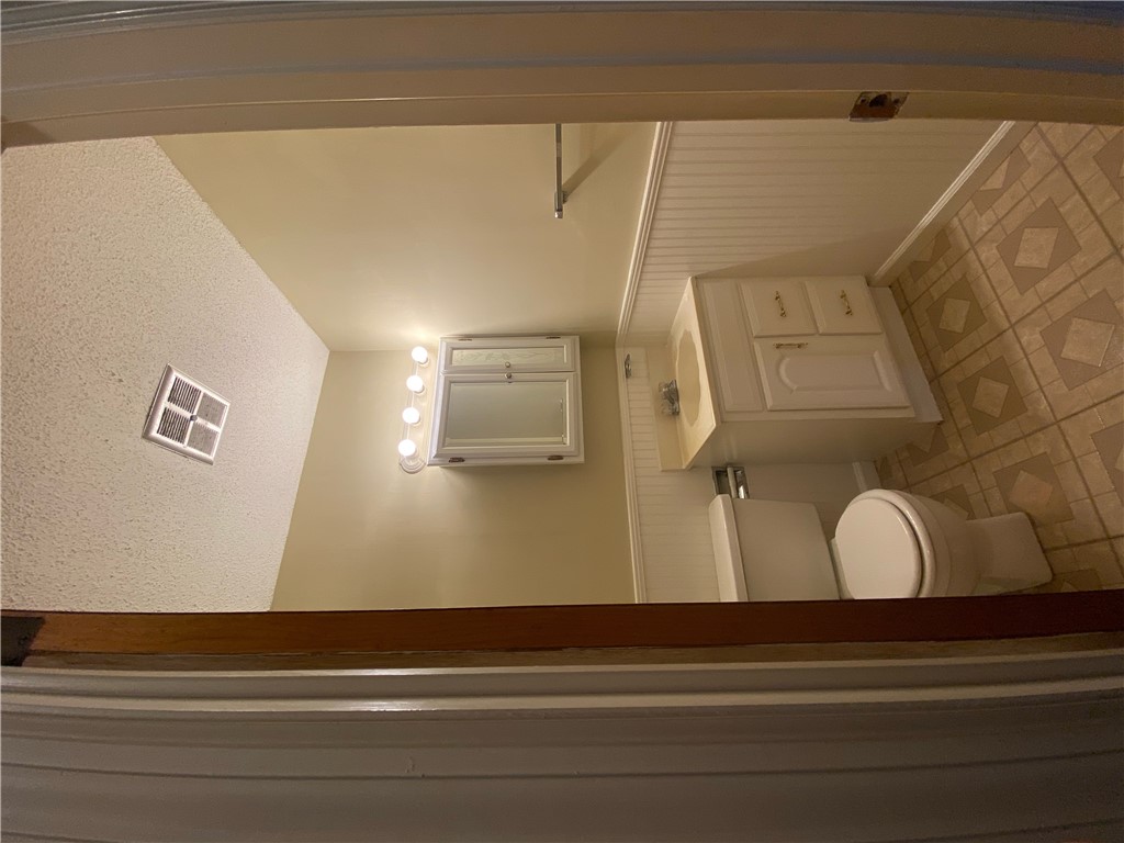 1424 East Calhoun Street Anderson, SC 29621 - Photo 6 of 10 A well-lit bathroom with a bright vanity and functional fixtures awaits your personal touch.