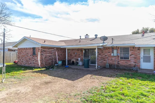 a view of patio with table and chairs potted plants
