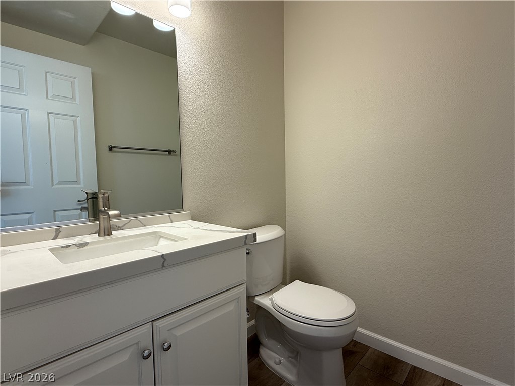1908 Thunder Ridge Circle Henderson, NV 89012 - Photo 10 of 28 A well-appointed lavatory boasts a pristine vanity and dark-toned flooring.