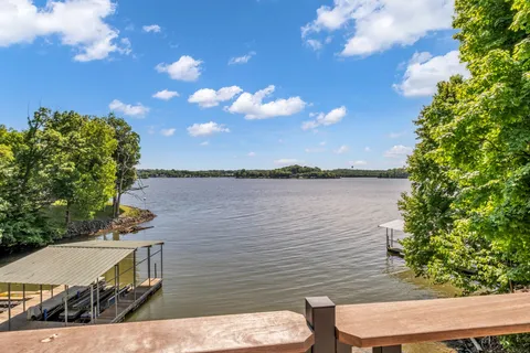 a view of a lake from a balcony