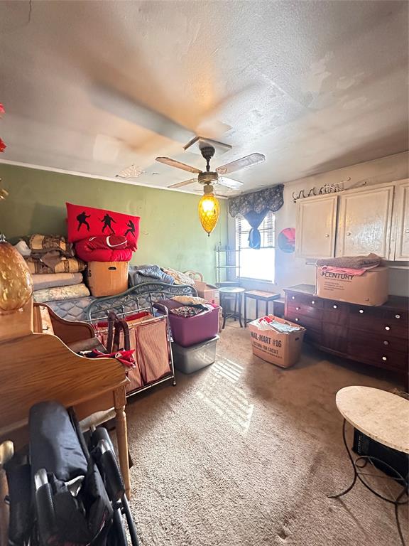 426 Goodyear Street Irving, TX 75062 - Photo 15 of 15 a bedroom with furniture and a chandelier