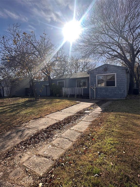 426 Goodyear Street Irving, TX 75062 - Photo 4 of 15 a view of a house with a yard