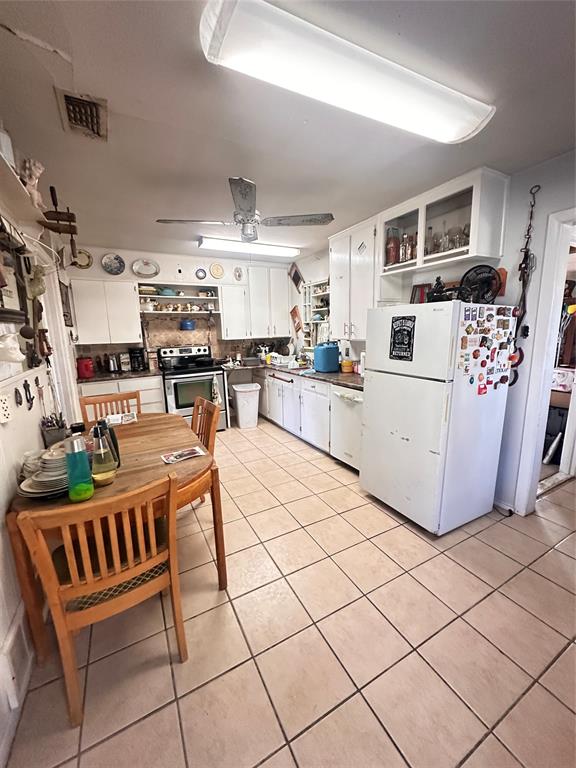 426 Goodyear Street Irving, TX 75062 - Photo 8 of 15 a living room with lots of furniture and appliances