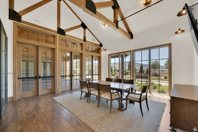 6120 North Sheps Ridge Road Eagle Mountain, UT 84005 - Photo 24 of 43 Vaulted ceiling with exposed wood beams and industrial-style lighting