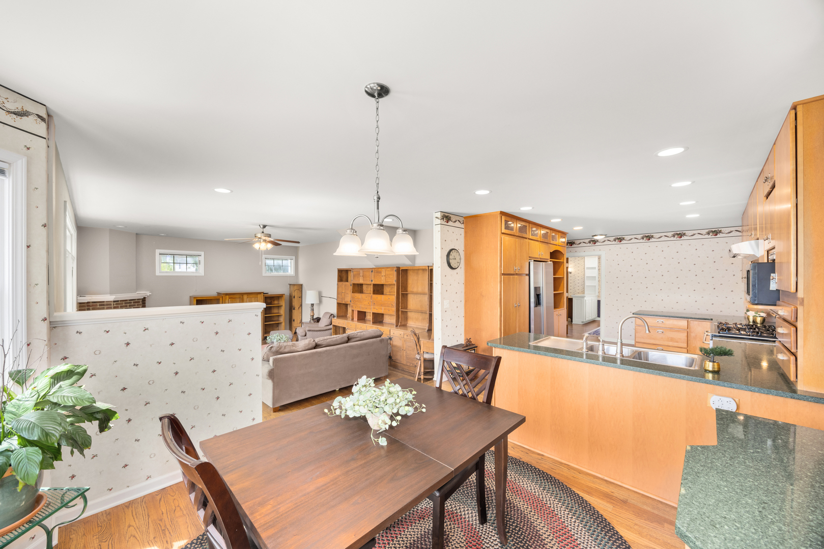 401 Greenwood Road Glenview, IL 60025 - Photo 11 of 30 a view of kitchen with granite countertop lots of counter top space and living room